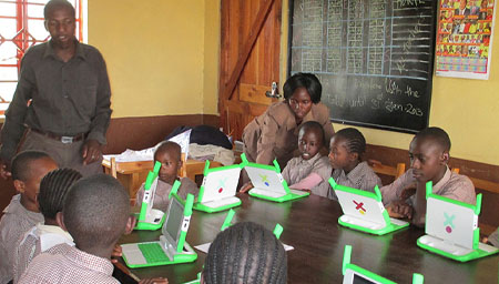classroom of students using One Laptop per Child computers