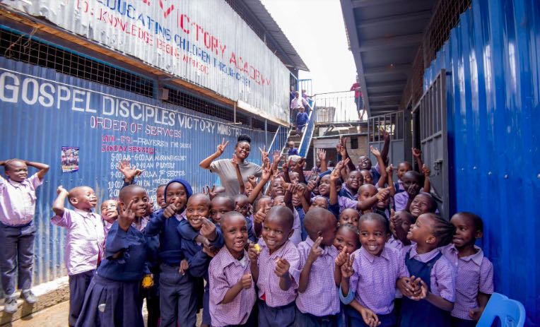 group of school-aged children by a gospel center in kenya