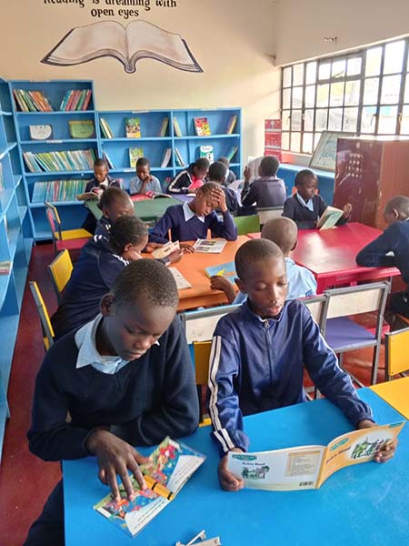 students reading at the library desks