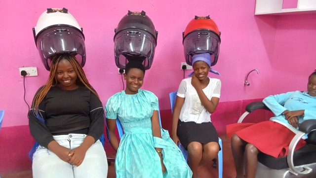 Thika-Cosmetology2 sitting under the hairdryers in the Thika training salon